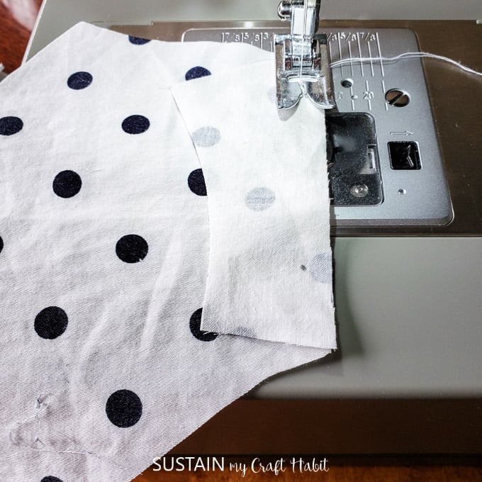 Sewing a side panel into the polka dot fabric.