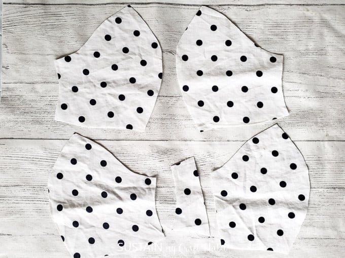 Cut pieces of polka dot fabric.