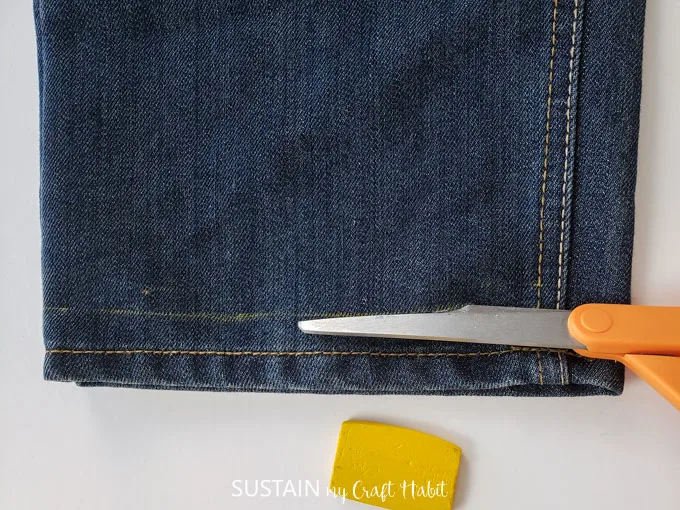 Cutting a new hem for frayed hem pant.
