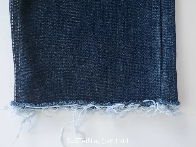 Making the frayed edge on jeans.