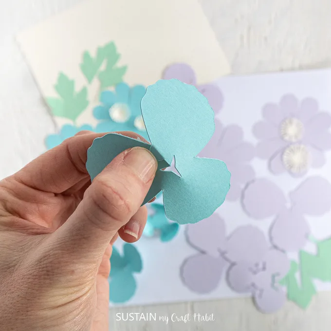 Folding the blue petal.