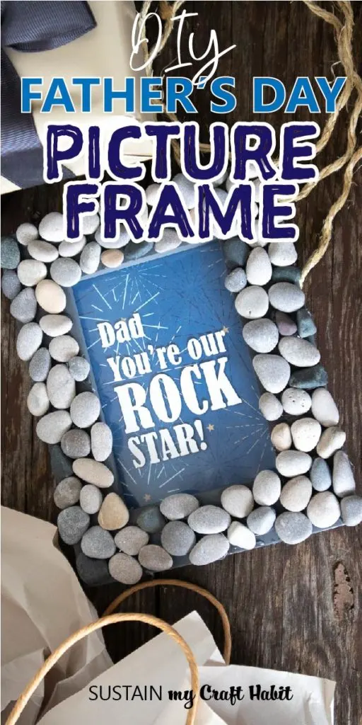 A picture frame with rocks glued around the frame and text on the glass saying "Dad you're our rock star!"