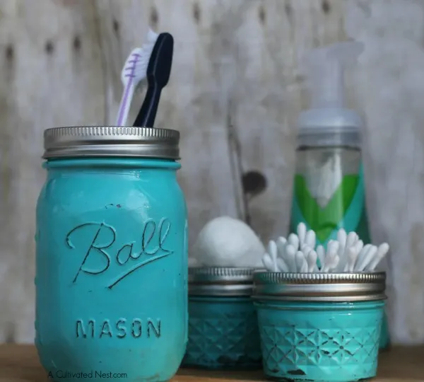 Ball jars and small glass jam jars painted teal
