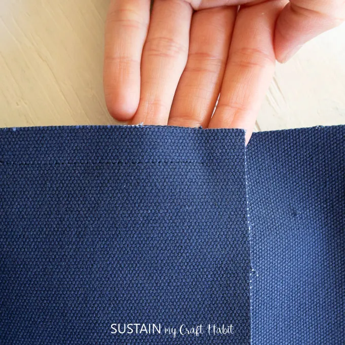 Close of image of blue canvas fabric with a 1/2" seam allowance.