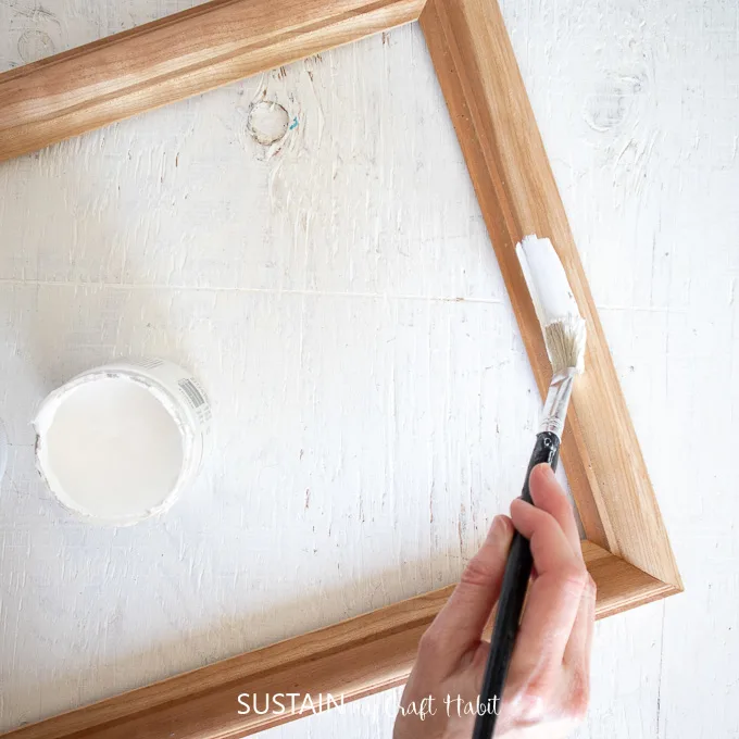 Painting the surface of a picture frame.