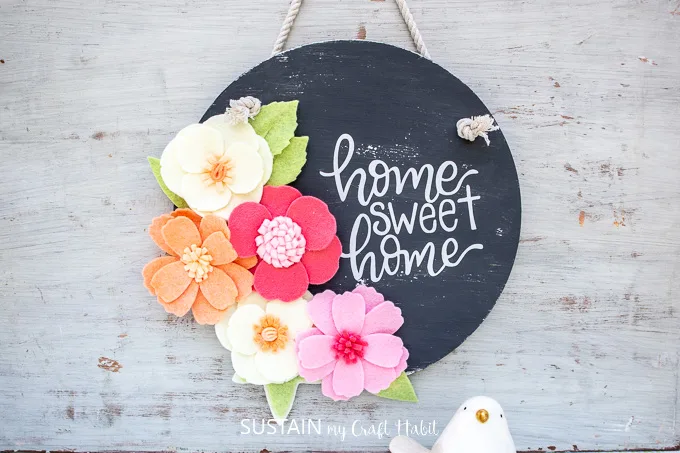 Home sweet home upcycled DIY wood sign with felt flowers.