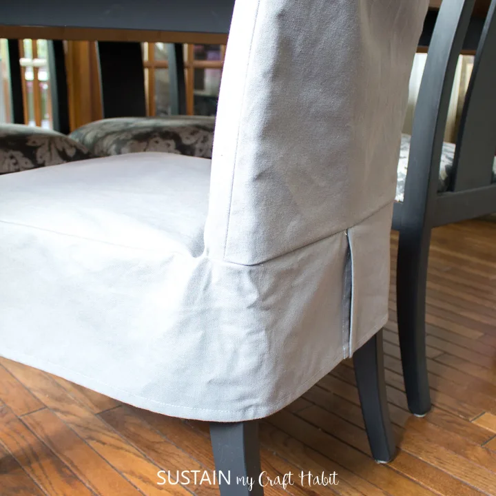View from behind of a completed dining chair slipcover in place.