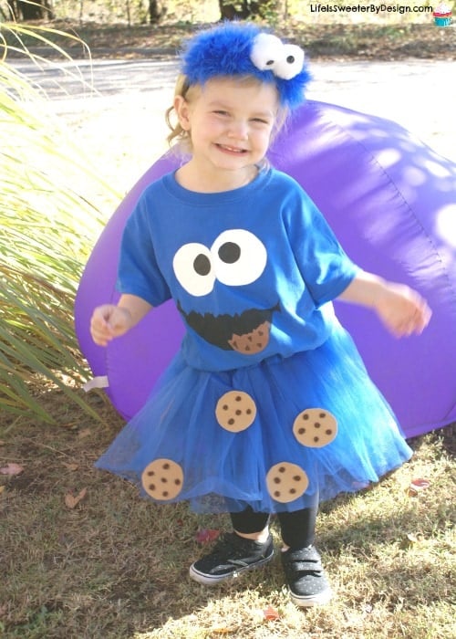 Toddler wearing blue tshirt and tulle skirt with embellishements to look like the cookie monster.