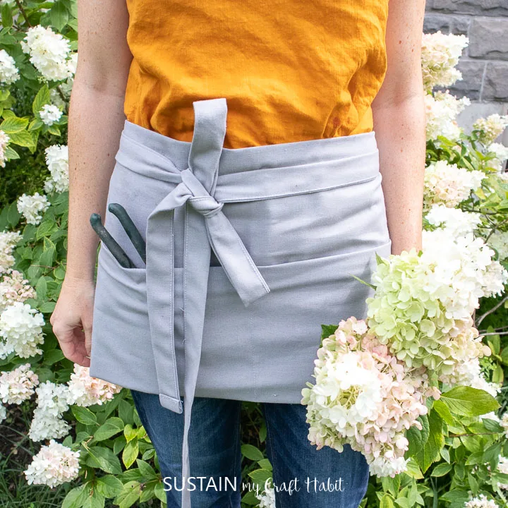 a canvas half apron worn outside in the garden