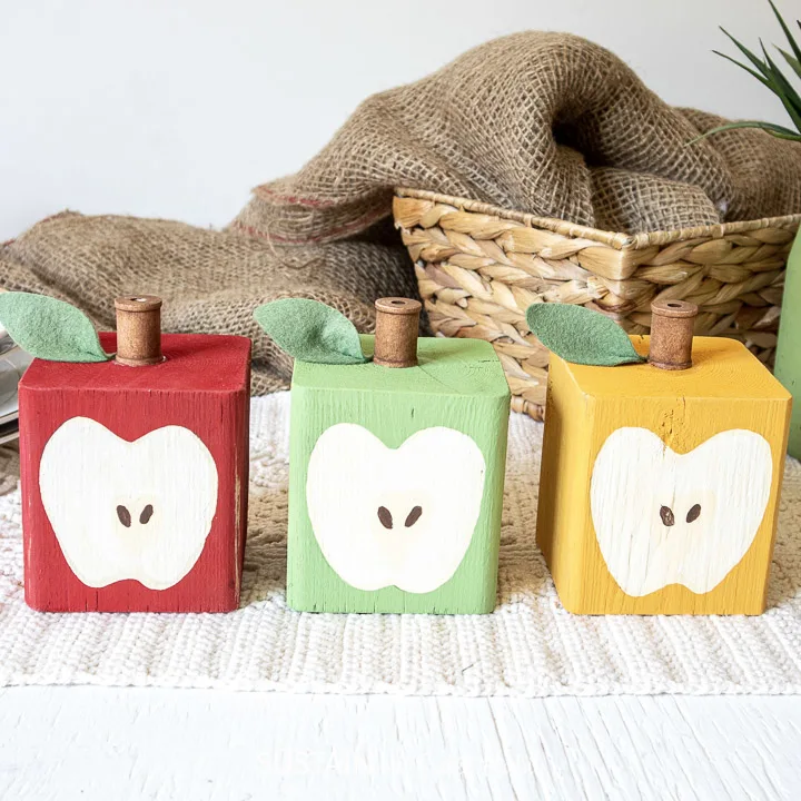 set of 3 DIY wood block apples all lined up in a row