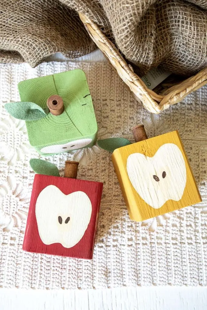 Finished Wood Block Apples painted red, green and yellow.