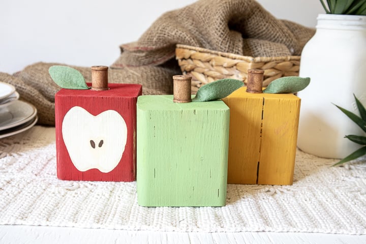 set of 3 DIY apple decorations made using scrap wood and paint