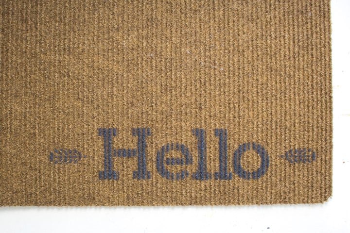 Removed Stencil to reveal a painted "hello" on the welcome mat.