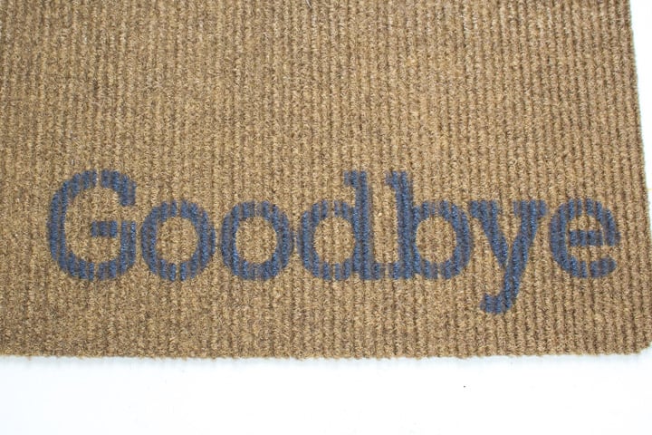 Painted "goodbye" on the welcome mat.