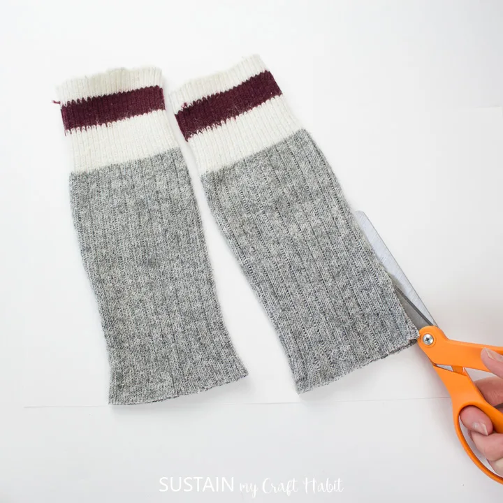 Cutting the length of the wool tube socks.