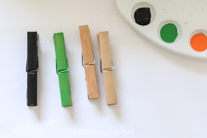 Painting another clothespin black.