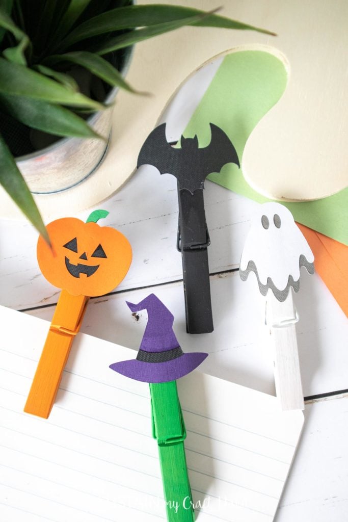 Painted clothespins with Halloween images on top.