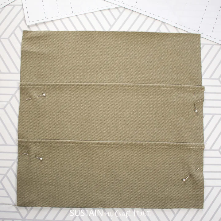 All three layers of the knitting needle cas e pattern pinned together.