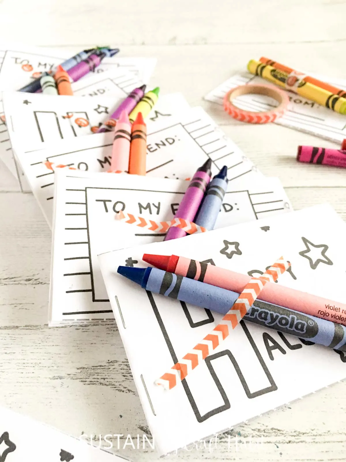 Printable Halloween coloring books with colorful crayon attached with washi tape.