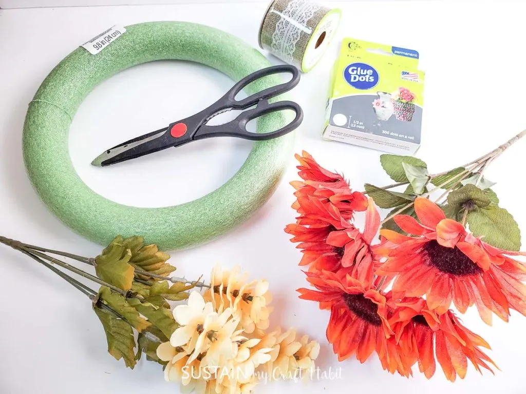 Materials needed to make a dollar store fall wreath.