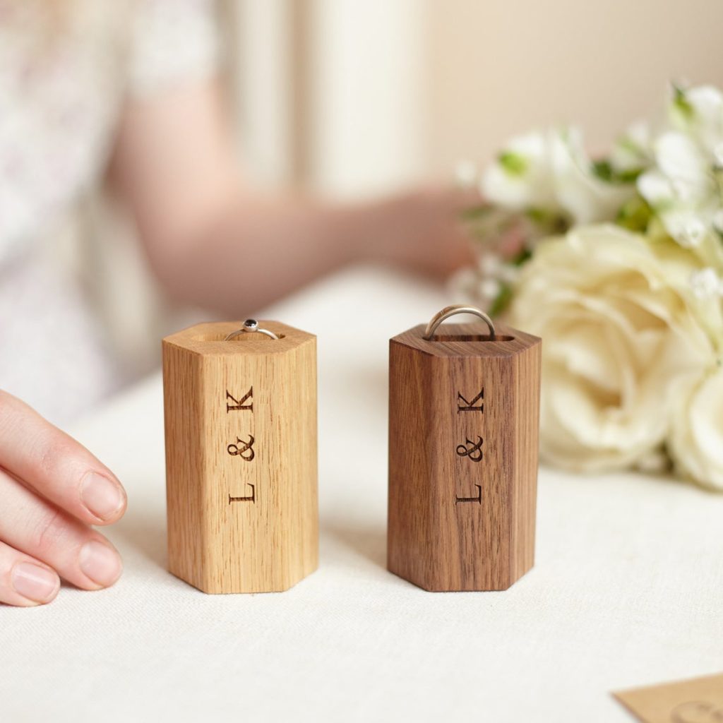 Engraved wooden ring holders.