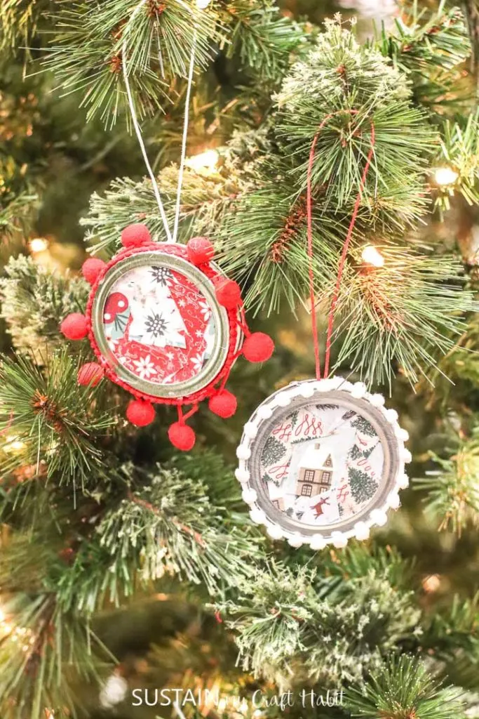 Canning jar lid ornaments hanging from a tree.