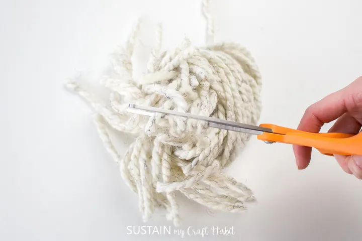 Cutting the yarn loops.
