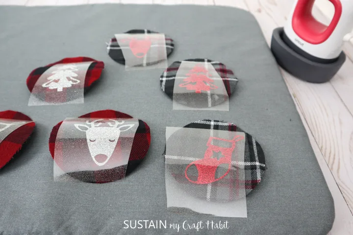 Placing the cut images on top of the flannel fabric cutouts.