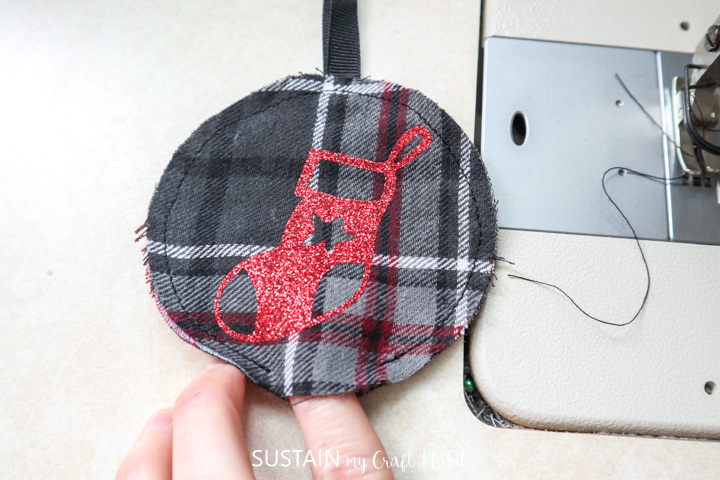 Stitching around the outer edge of the flannel ornament leaving a finger size gap.
