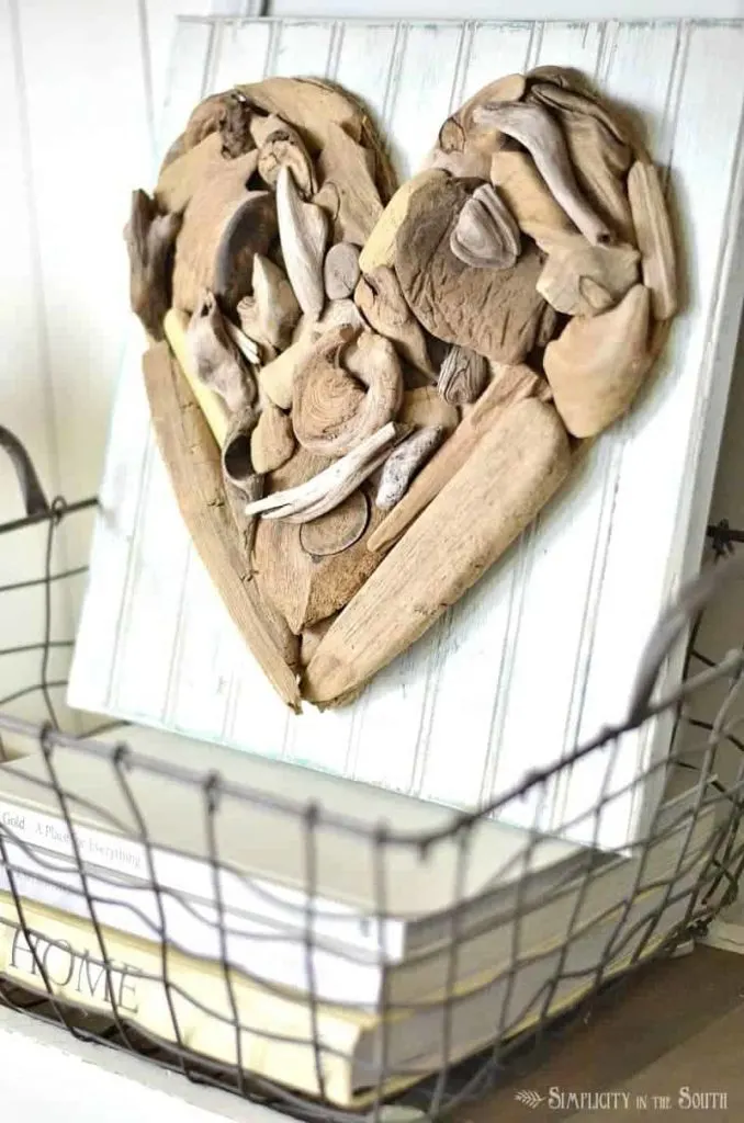 A heart shaped piece of decor made with driftwood pieces.