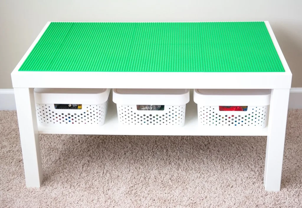 Lego table with white baskets.