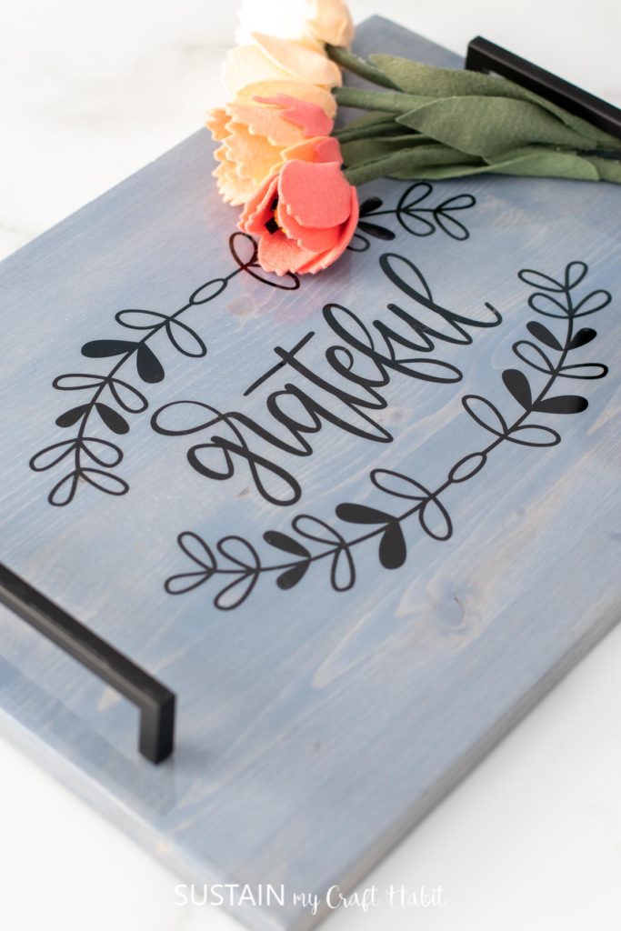 Farmhouse inspired wood serving tray with the words "grateful."