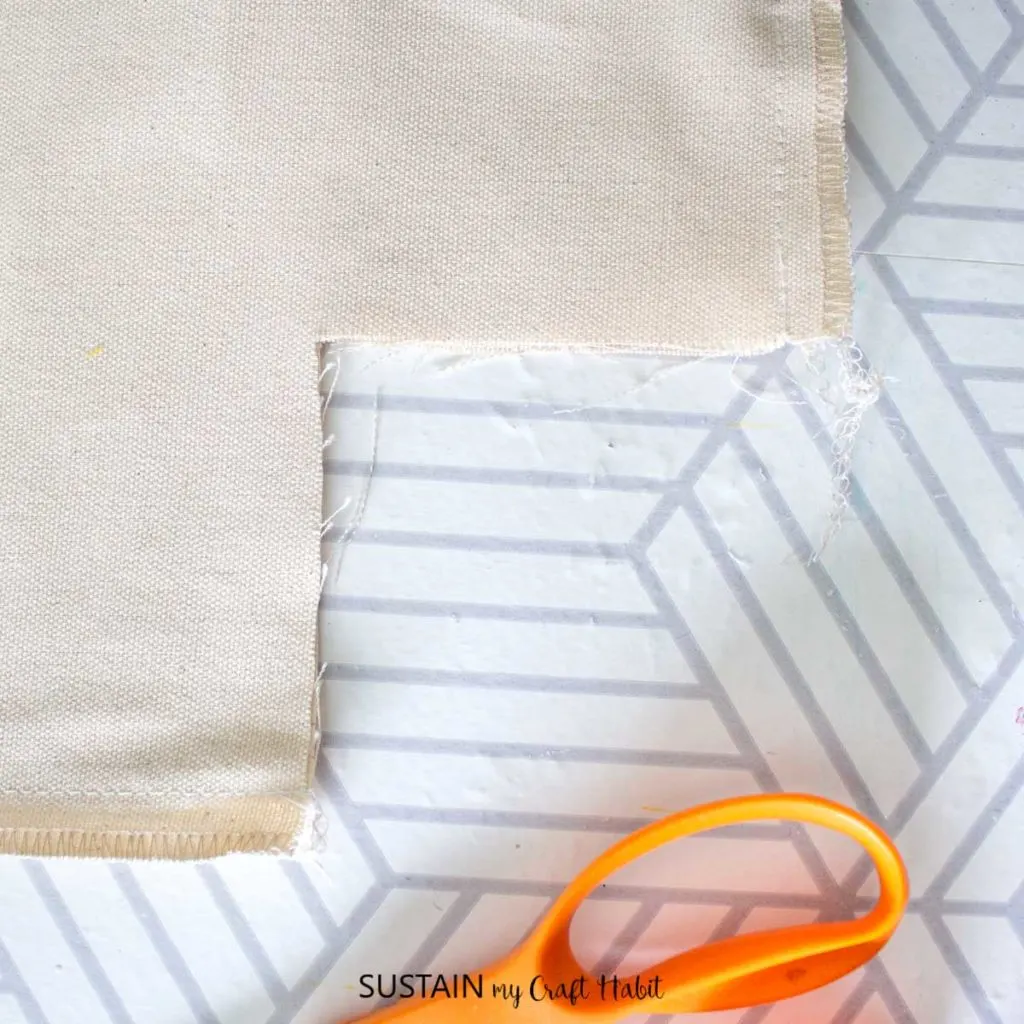 Cutting out a piece of fabric.