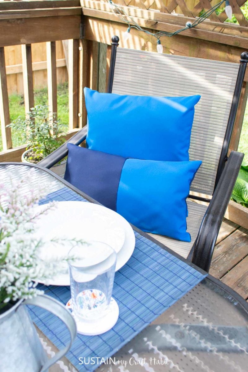 Blue outdoor pillows on a chair.
