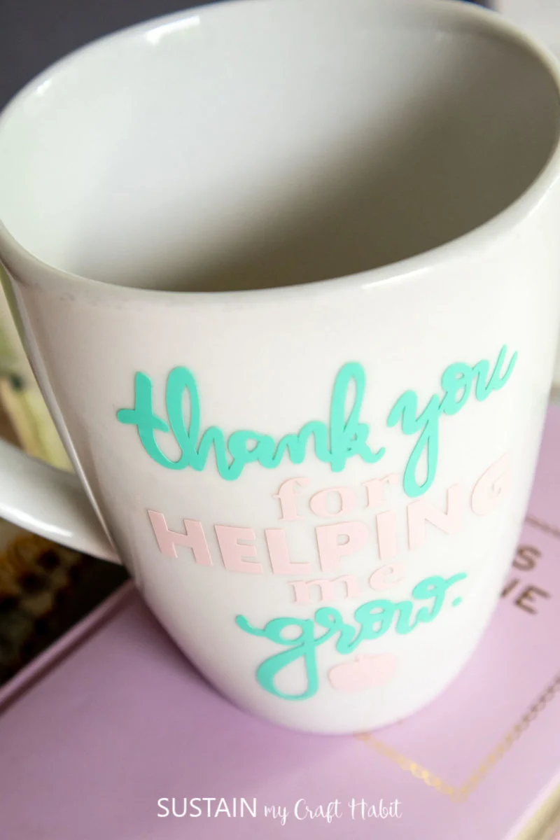 Close up of the coffee mug for teachers with the phrase "thank you for helping me grow" on the front.