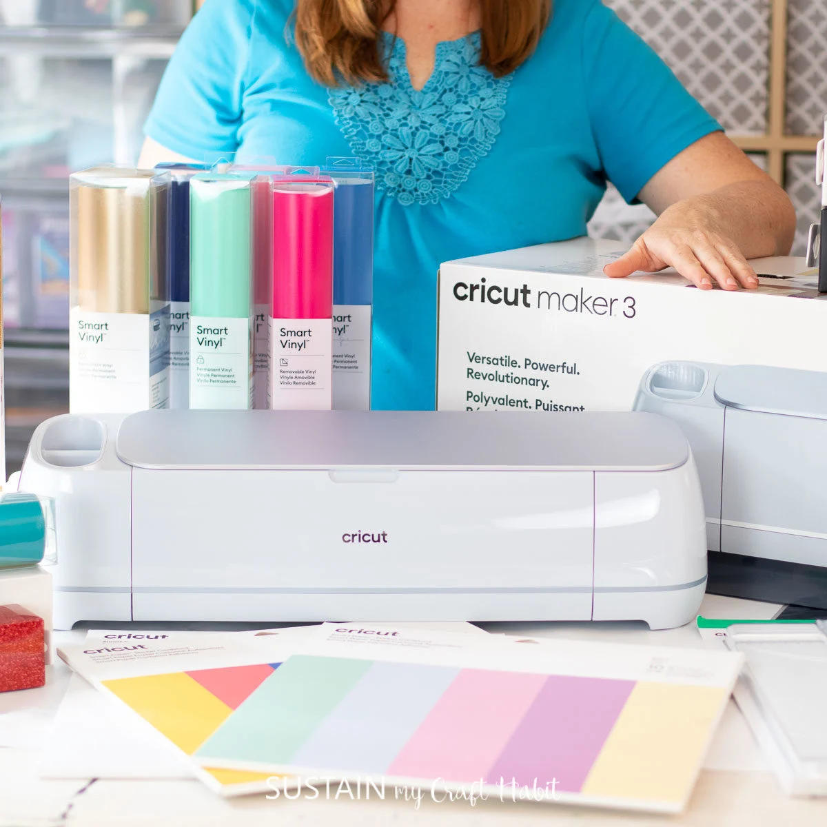 cricut maker 3 on a table in front of a woman