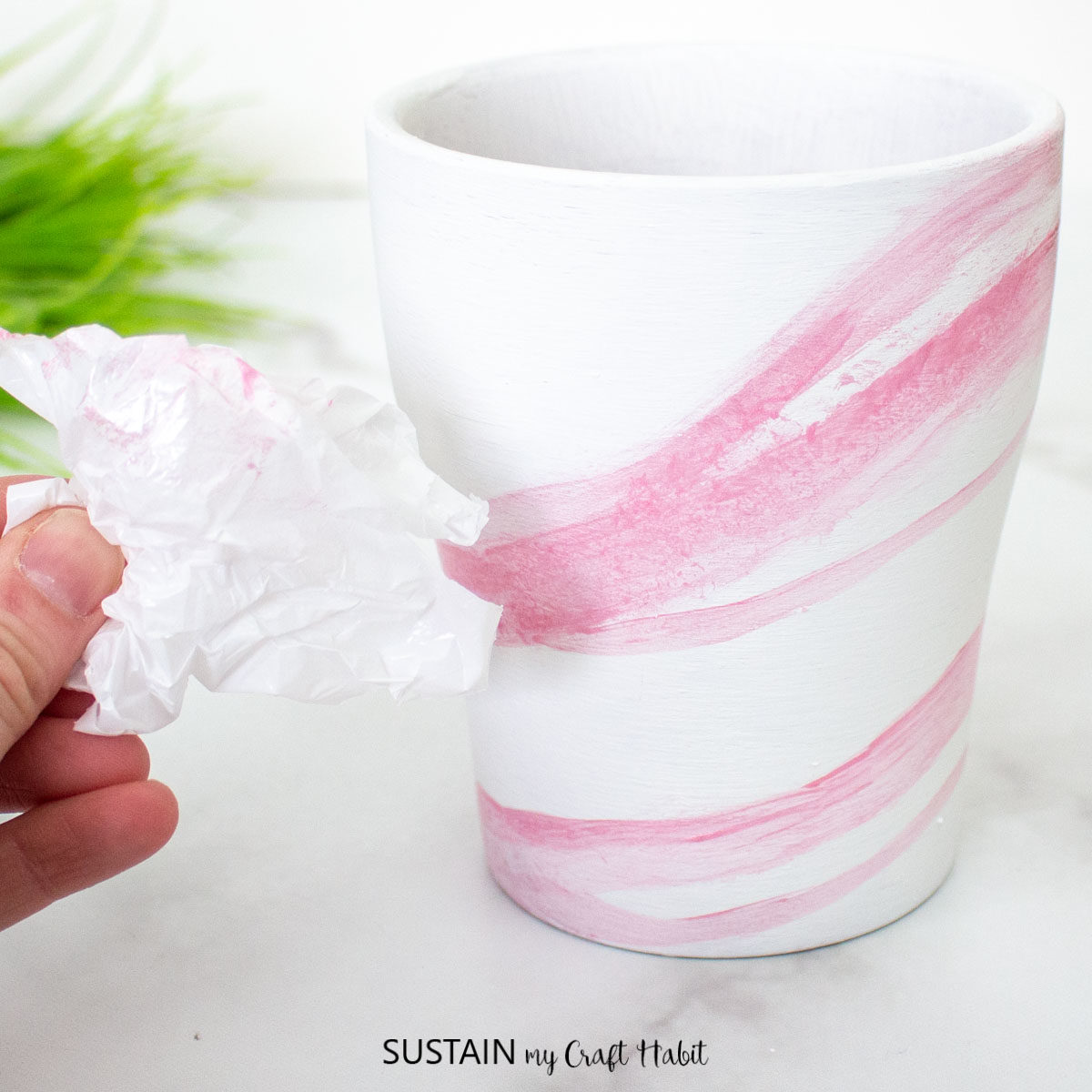 Painting a pink marble effect.
