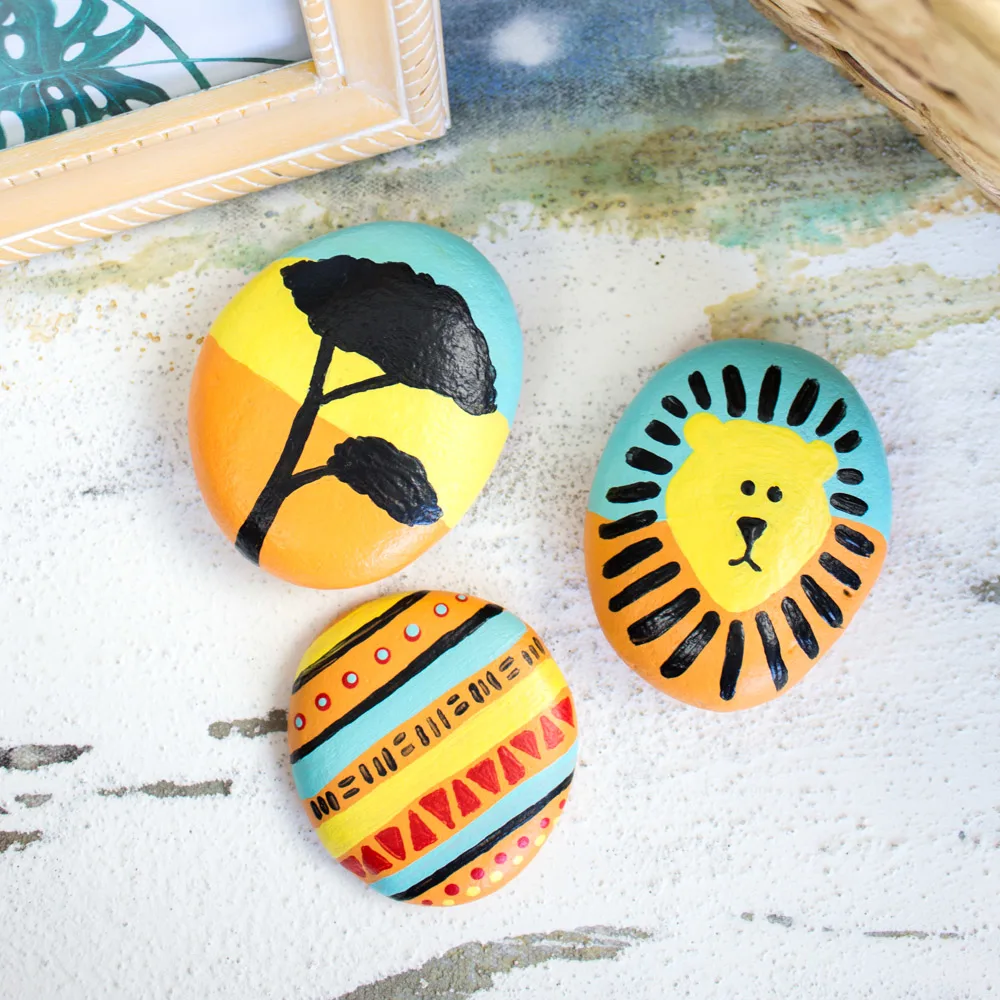 Lion king inspired painted rocks.