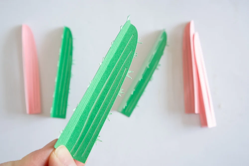 Folding the cut Cactus pieces.