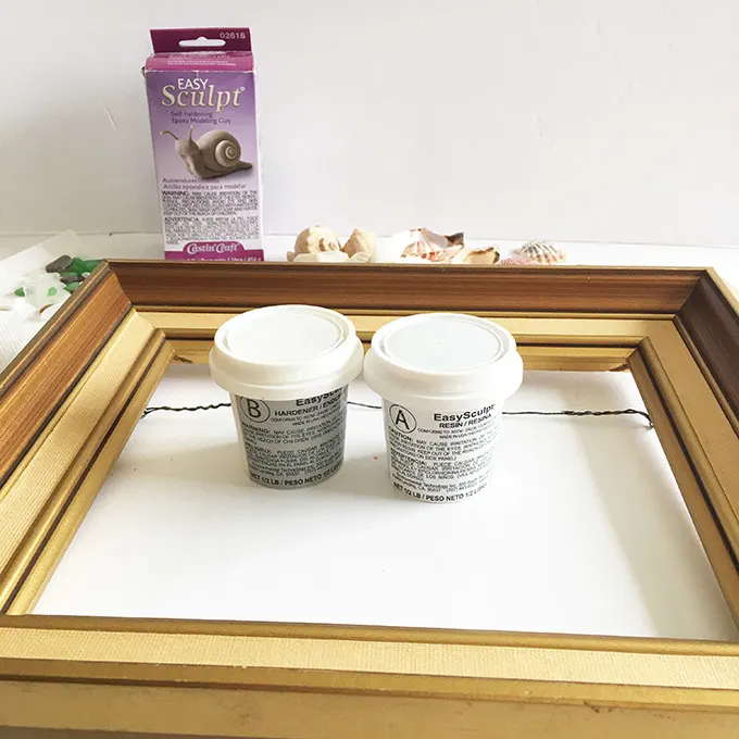 Materials needed to make a Beachcombers picture frame with EasySculpt epoxy including sculpting clay, a picture frame, embellishments., 