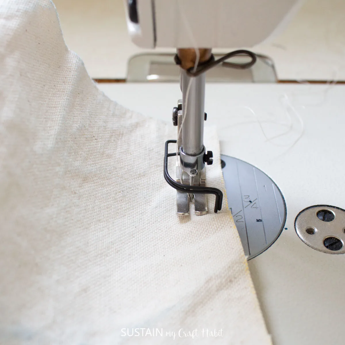 Sewing the zipper onto the canvas fabric.