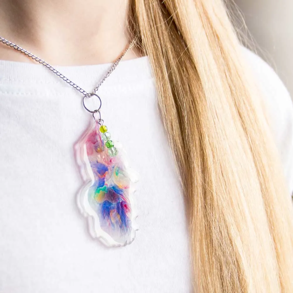 Wearing a resin feather pendant.