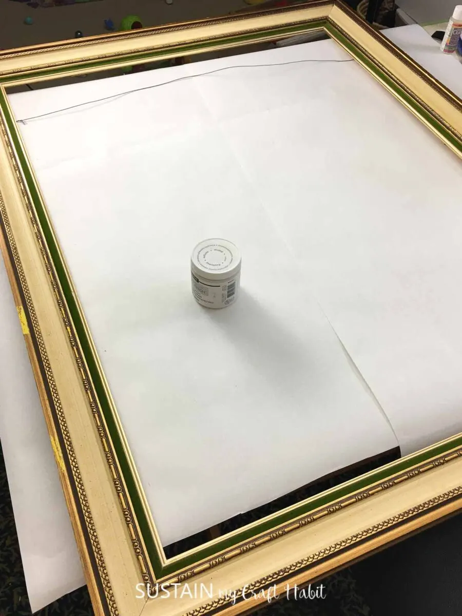 Large gold frame and paint.