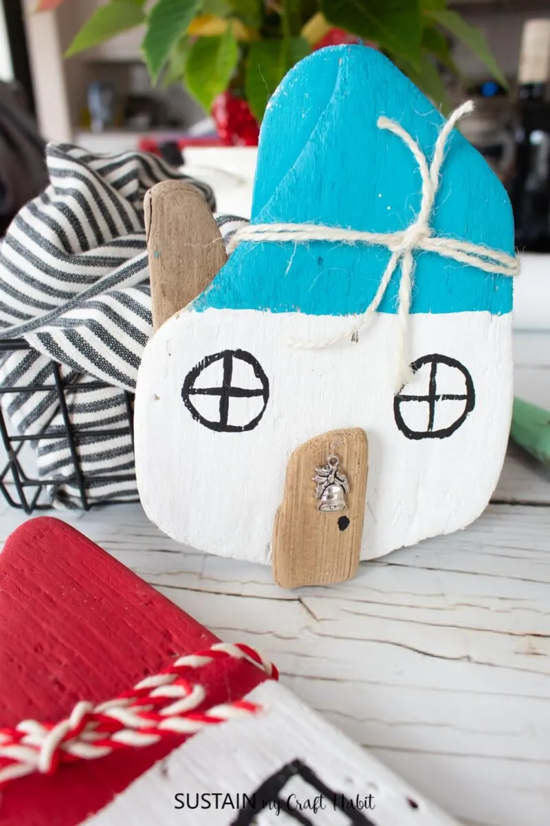 Painted driftwood Christmas house.