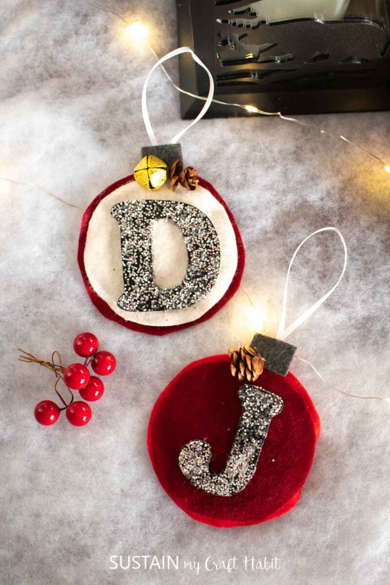 Felt monogram ornaments with the letters D and J.