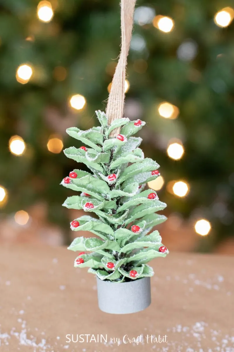 Homemade pine cone Christmas tree ornament.