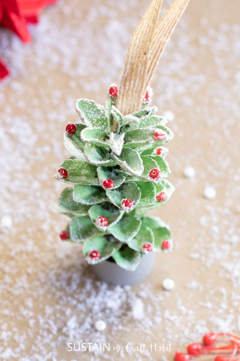 Homemade pine cone Christmas tree ornament.