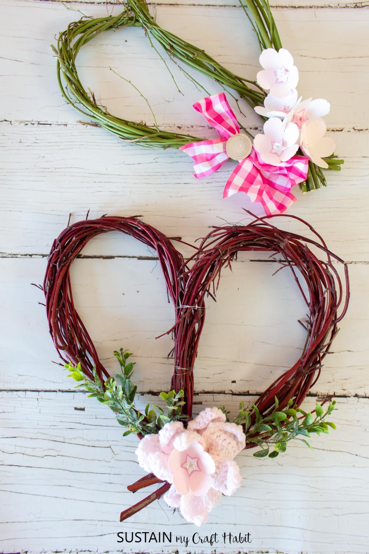 Sweetheart shaped dogwood wreaths embellished with flowers, greenery and ribbon.