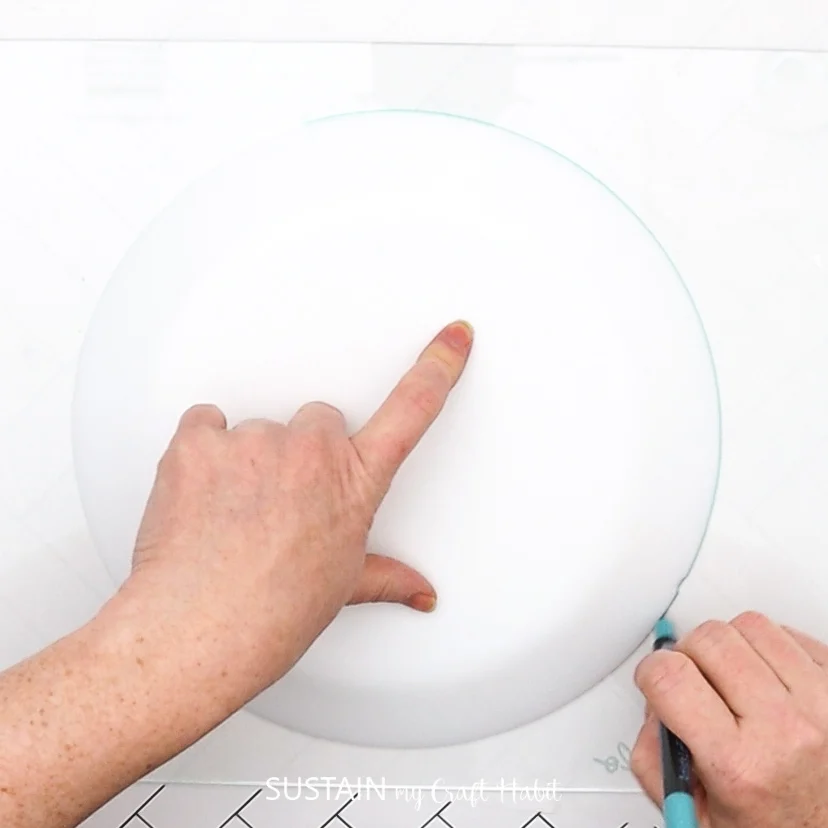Tracing a circle disc on glass.