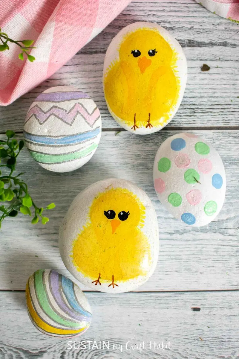 Easter rock painted baby chicks and Easter eggs.